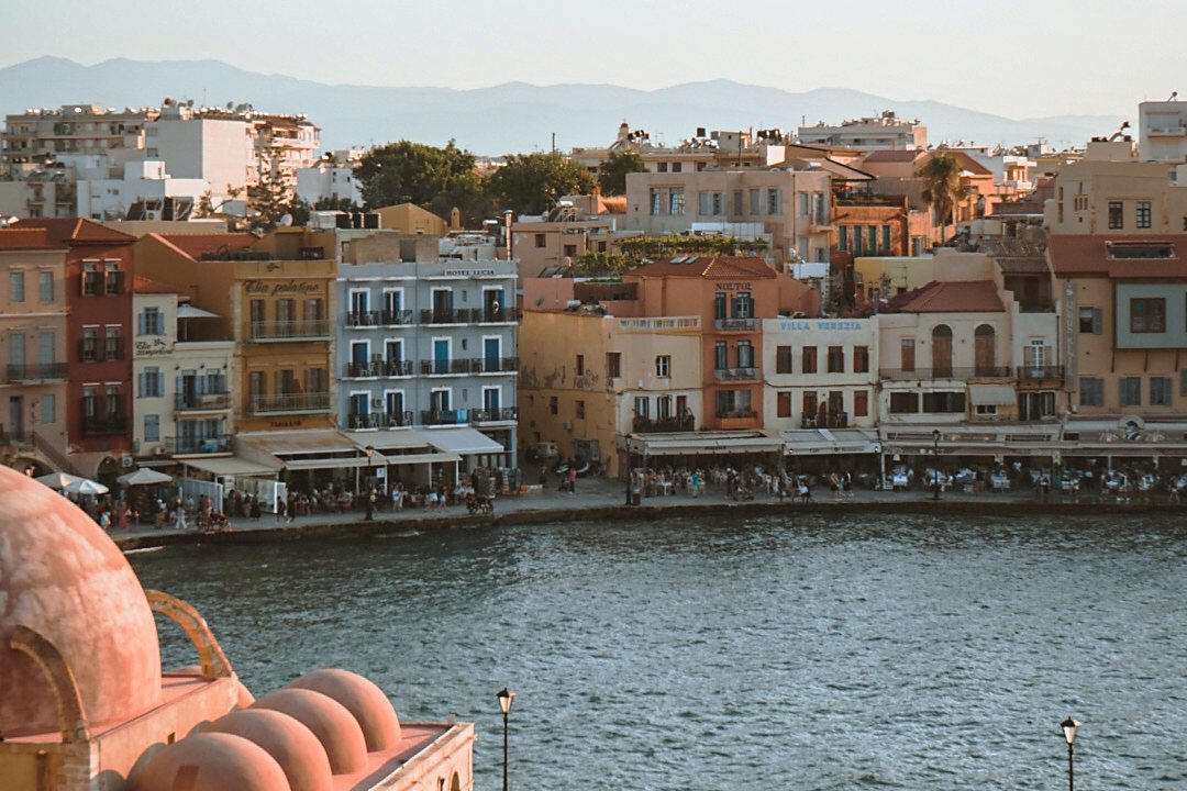 The Venetian harbour front at Chania, with the dome of the Kucuk Hasan mosque in the foreground