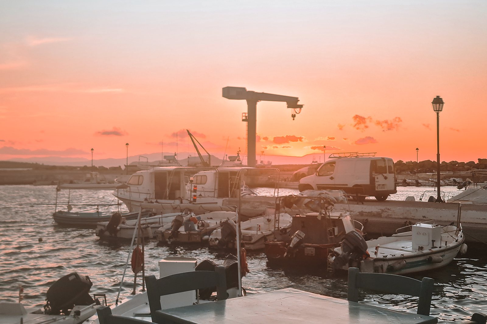 Fishing boats moored in Chania harbour at sunset