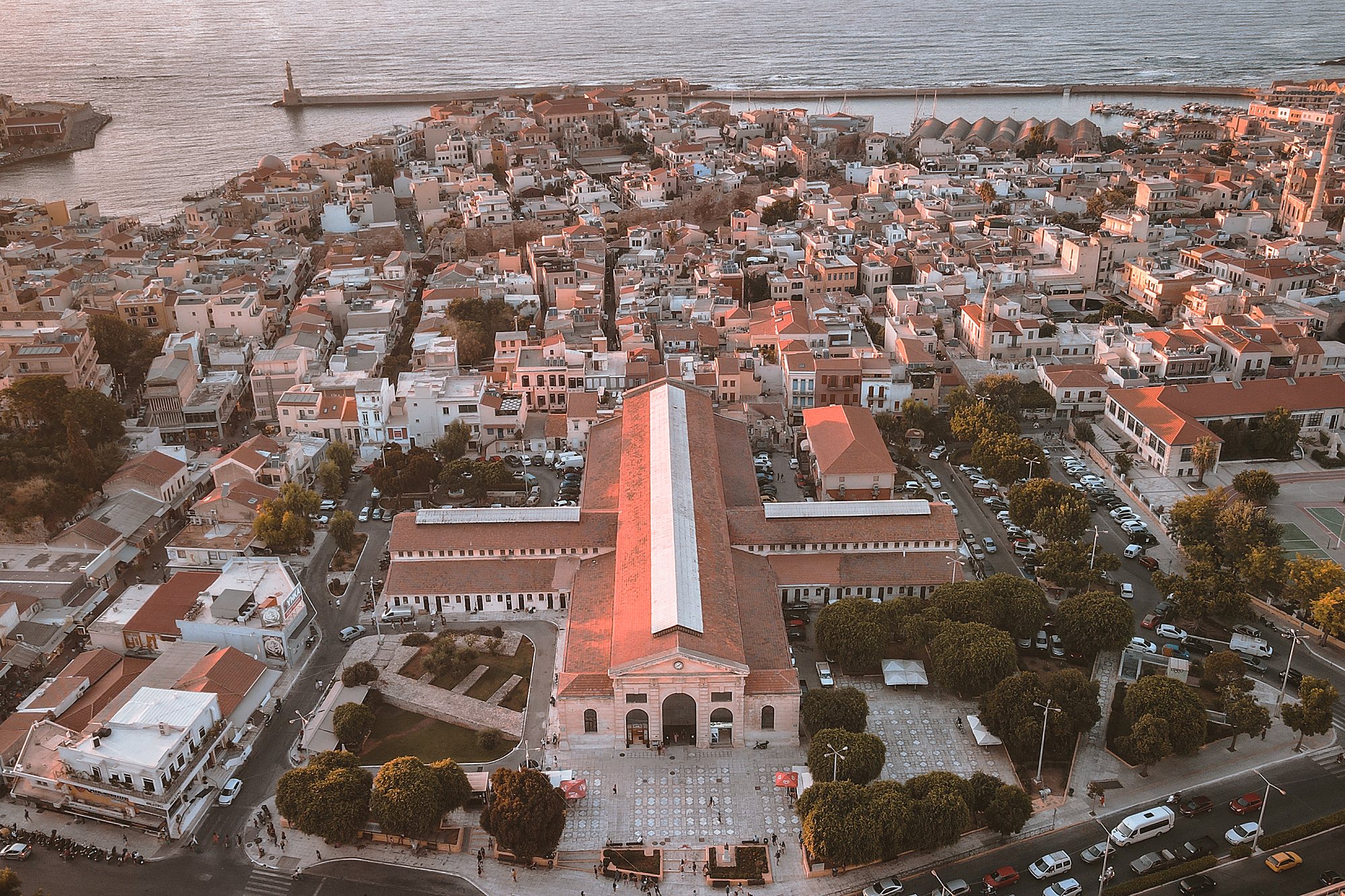 Aerial view of Chania Old Town at sunset, the Municipal Market at its centre and the harbour beyond